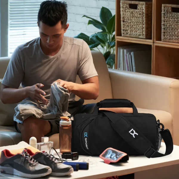 A man organizing items and putting into a workout bag sold by hundred spartans