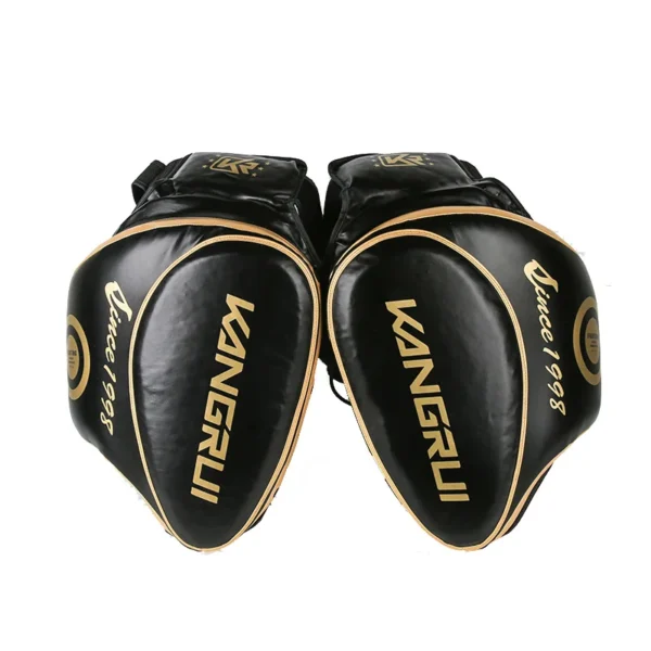 A pair of black thigh pads sold by 100 Spartans