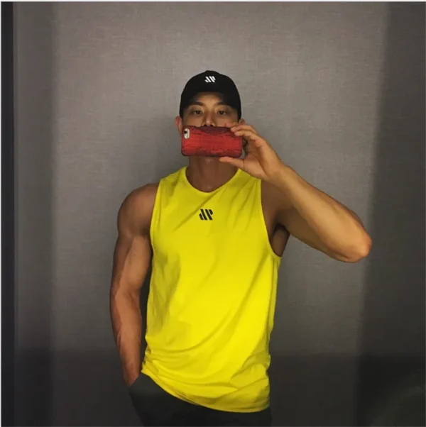 A yellow mens tank top sold by 100 Spartans