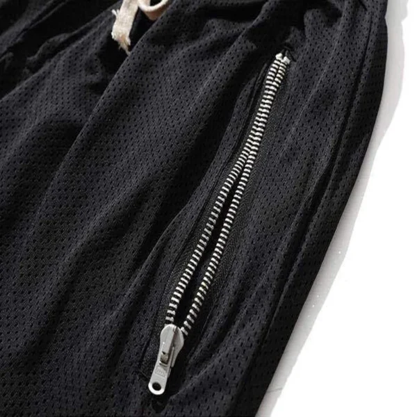 A black gym shorts showing the side zipper