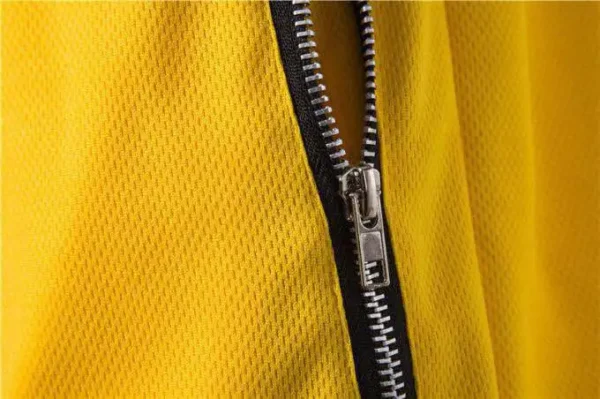 A yellow gym shorts showing the side zipper