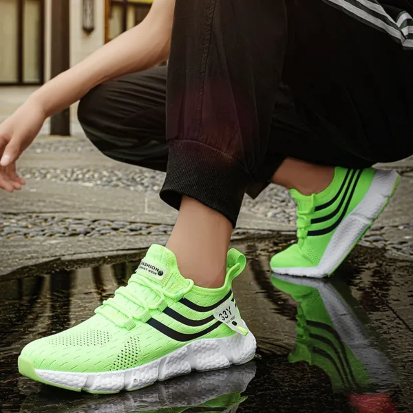 A person wearing green velocity Pro Running Sneakers sold by 100 Spartans