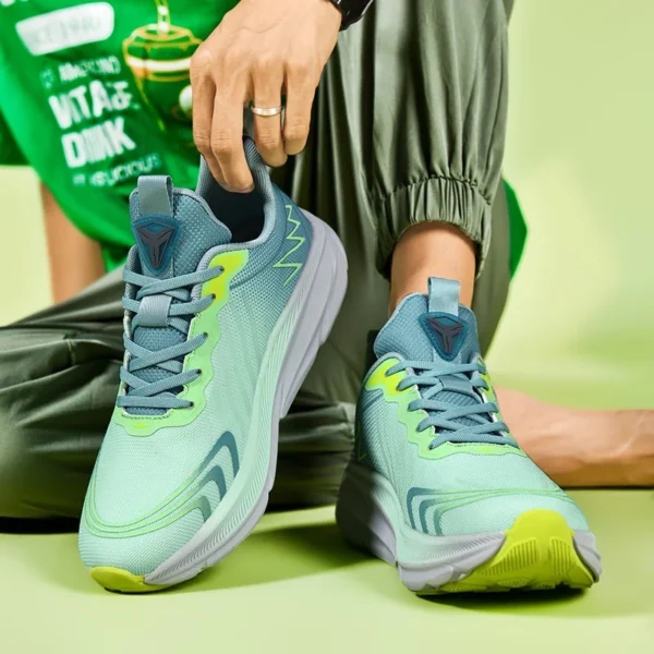 A man wearing a green Apex Stride 2023 Running Shoes sold by 100 Spartans