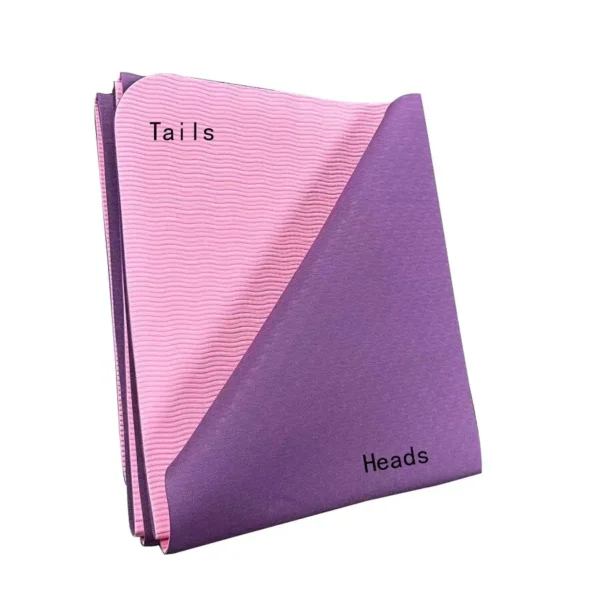 Someone holding a pink folded foldable yoga mat sold by 100 Spartans