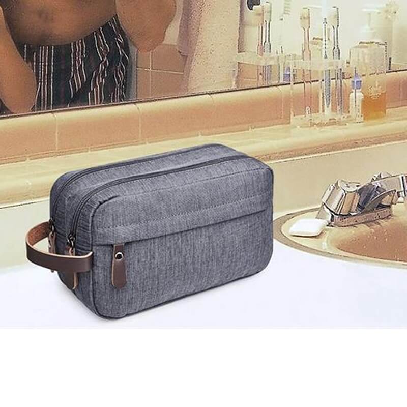 A grey toiletry bag for men sold by 100 Spartans