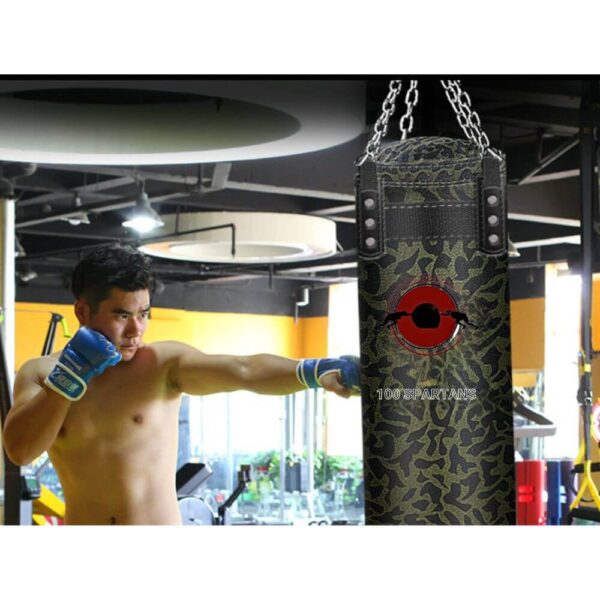 A man punching a hangable punching bag sold on 100 Spartans