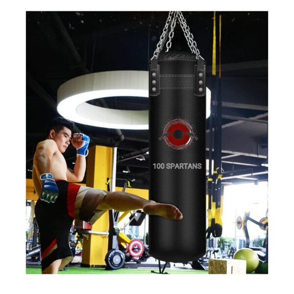 A man kicking a hangable punching bag sold on 100 Spartans