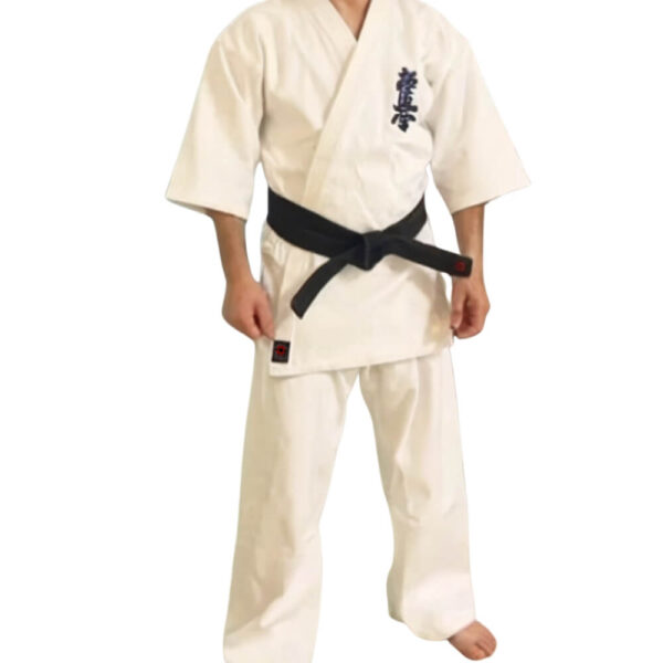 A man wearing a 12oz white Kyokushin Karate Uniform sold on 100 Spartans