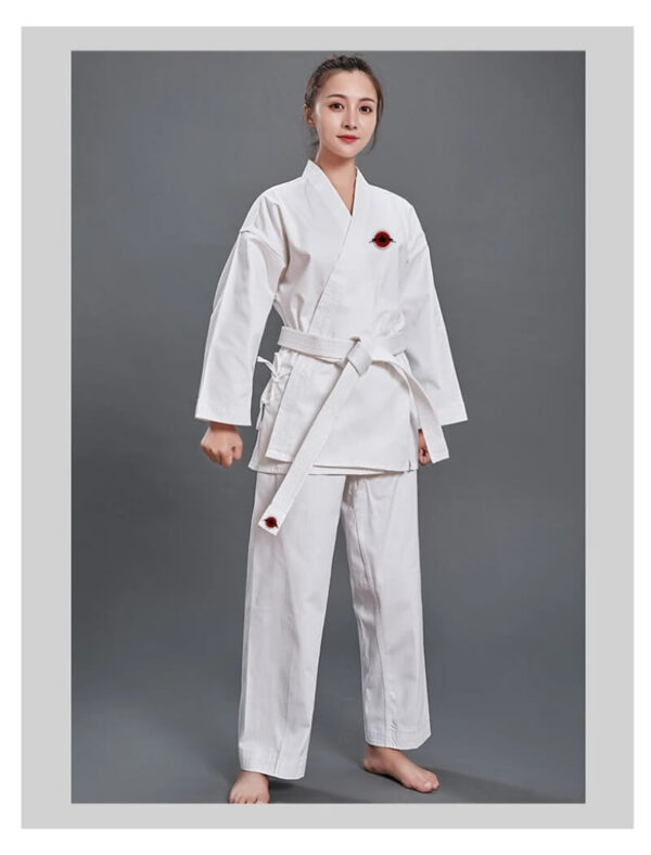 A woman wearing a14oz heavy karate gi and white karate belt sold by 100 Spartans