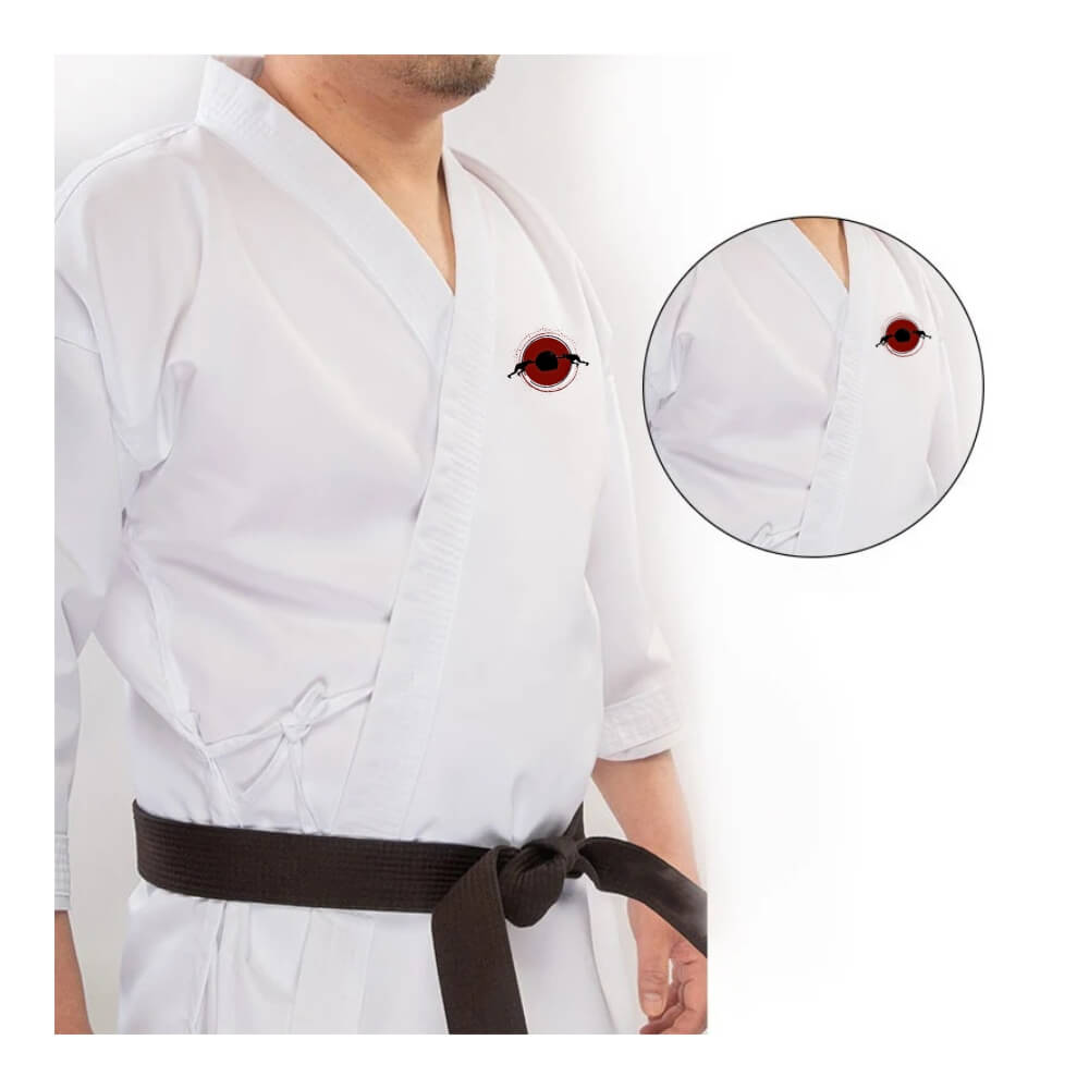 A man wearing a14oz heavy karate gi and black karate belt sold by 100 Spartans