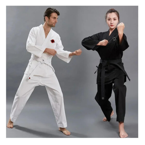 A man training while wearing a white karate gi and a woman training while wearing a 14oz heavy black karate gi sold by 100 Spartans