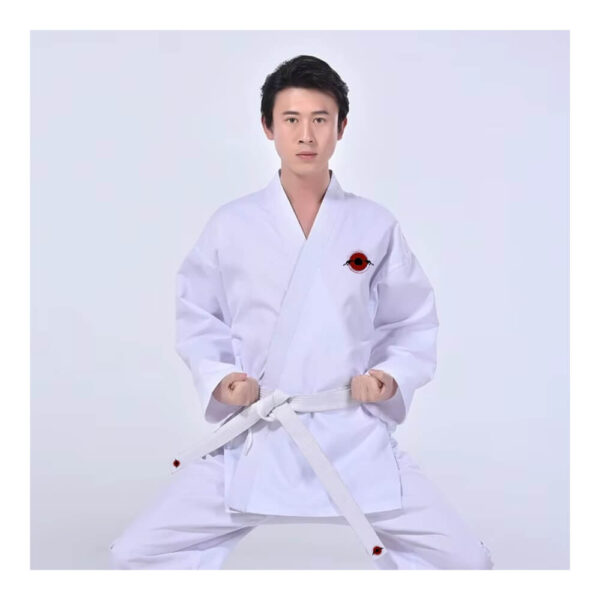 A man wearing a white 9.5oz Kumite Karate Uniform sold by 100 Spartans